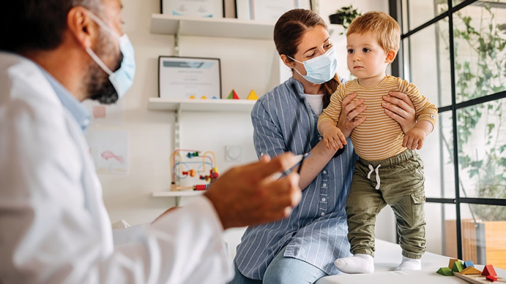 Mother with a toddler talking to a doctor