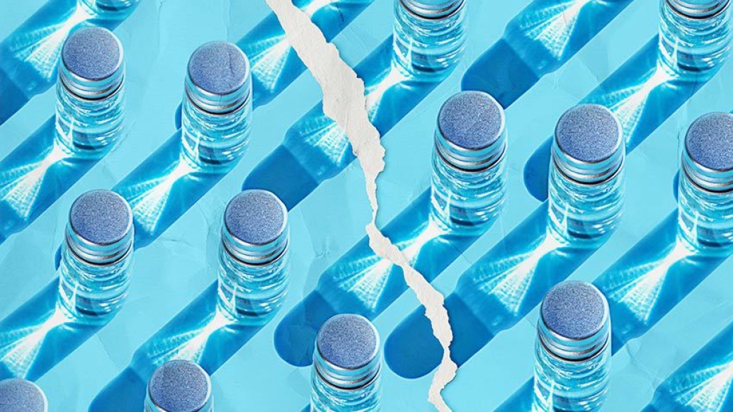 blue background with glass vials with torn paper in between 